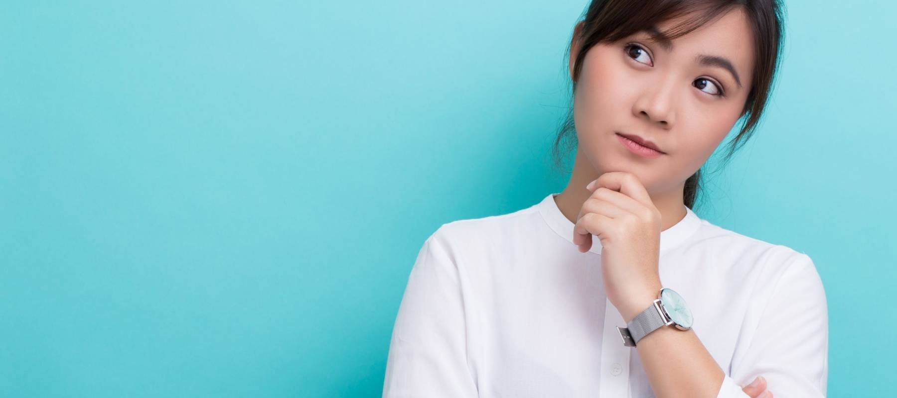 Asian woman thinking on isolated background