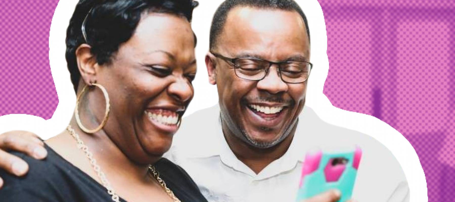 Middle aged couple laughs at phone