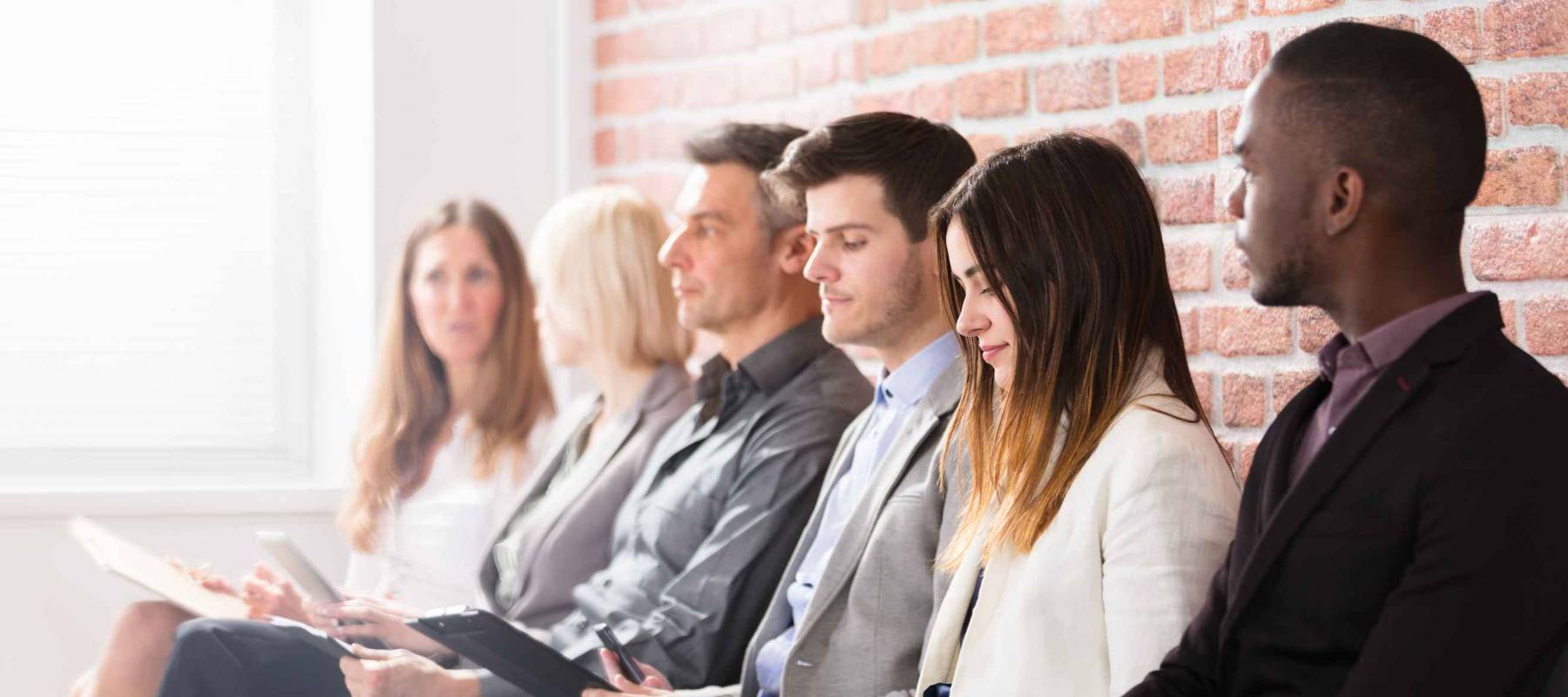 Group Of Diverse People Waiting For Job Interview In Office