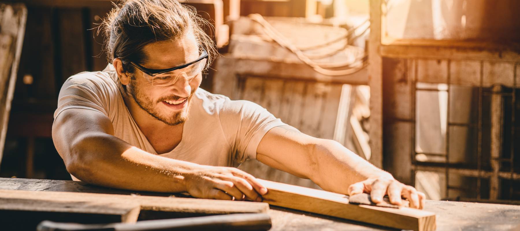 Young man working in carpentry, manufacturing