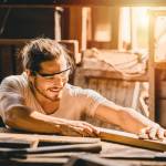 Young man working in carpentry, manufacturing