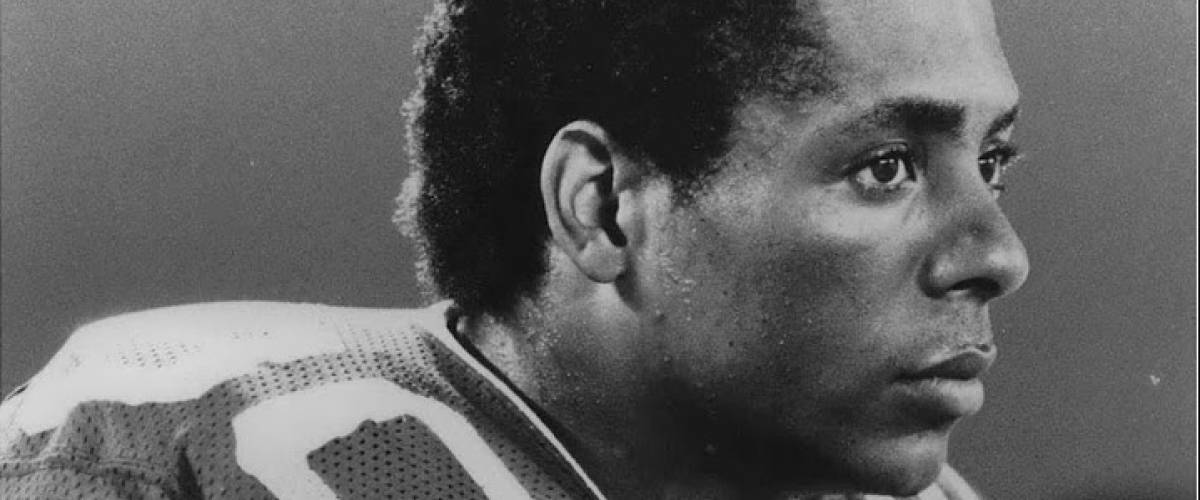 A side shot photo of Johnny 'Lam' Jones face in black and white