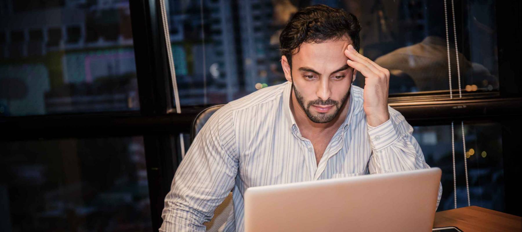 Portrait of stress sad business man working late at night time in office,  work from home concept.