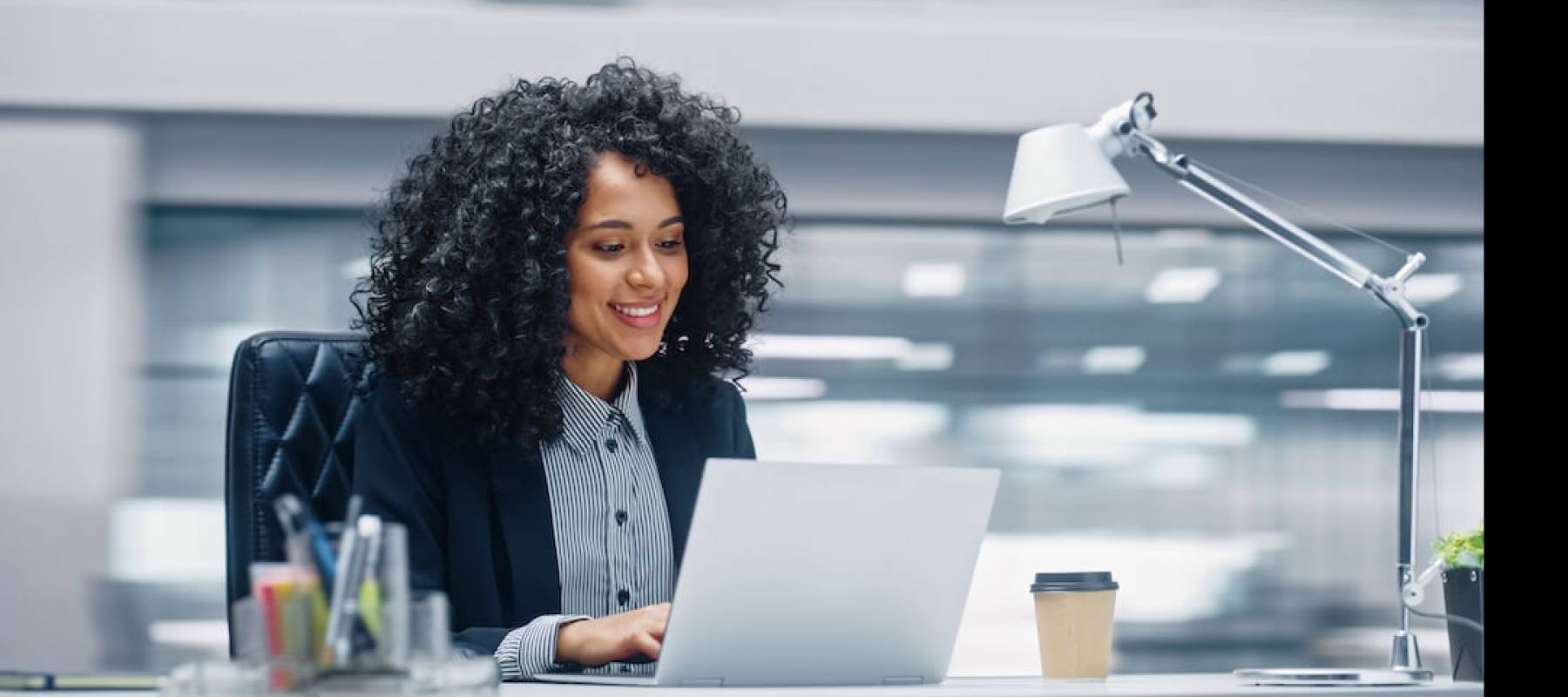 Woman in office on laptop