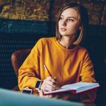 Thoughtful businesswoman pondering on strategy