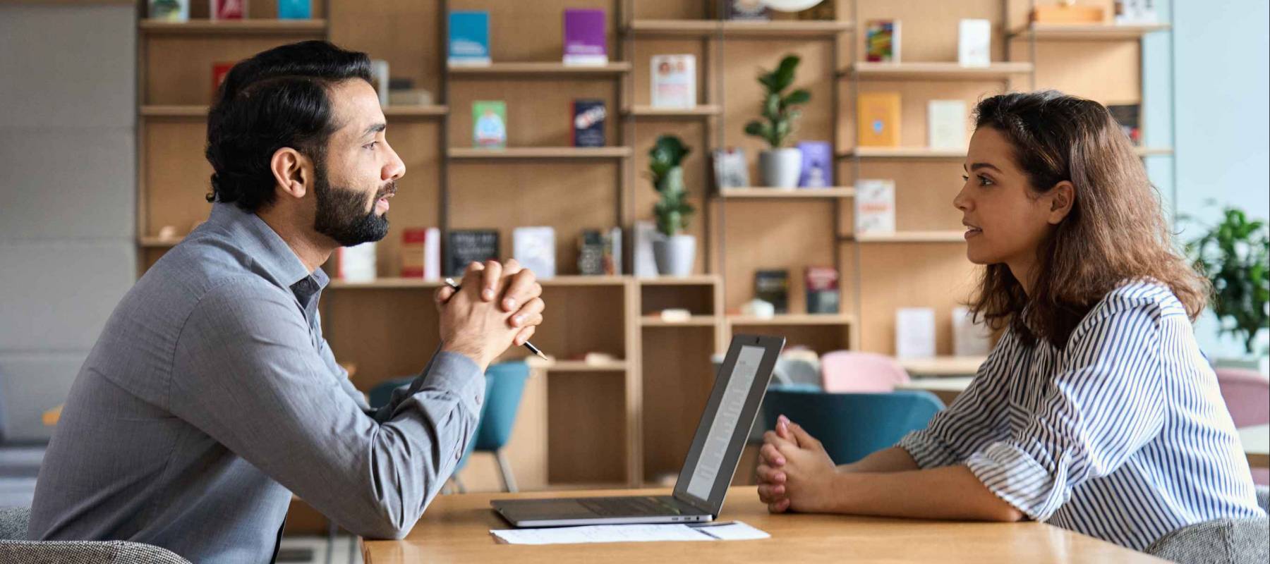 Indian male hr specialist manager and female latin candidate at job interview