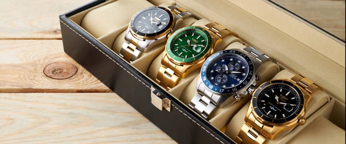 Collection of Invicta men quartz watches. Storage box with collection of men wrist watches.