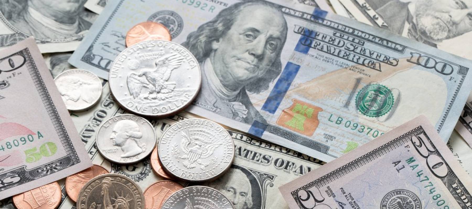 50 and 100 dollar bills and U.S. coins