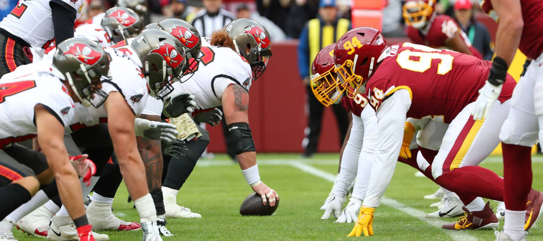 Nov 14, 2021; Landover, MD USA; A general view of the line of scrimmage with quarterback Tom Brady (12) of the Tampa Bay Buccaneers during an NFL game at FedEx Field.