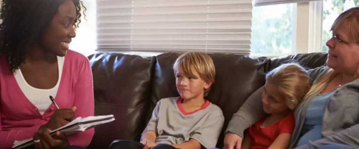 Health and human services worker with a family