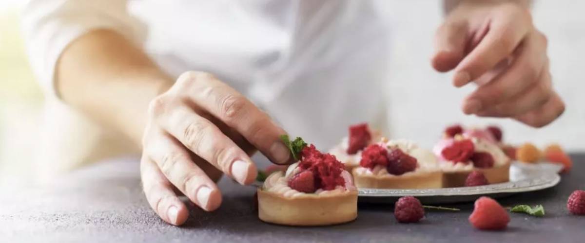 Pastry chef with tarts
