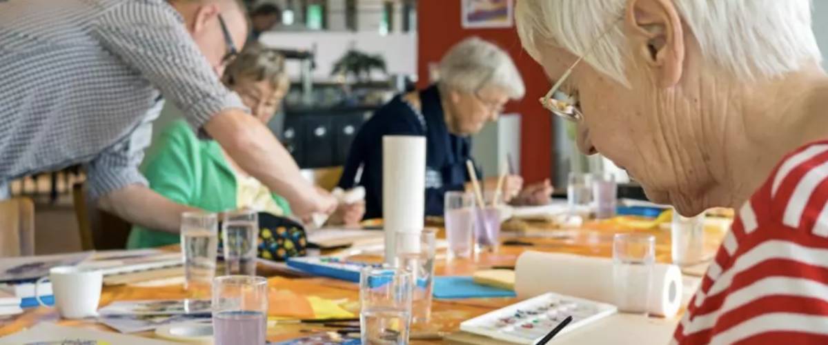 Seniors painting in recreational therapy