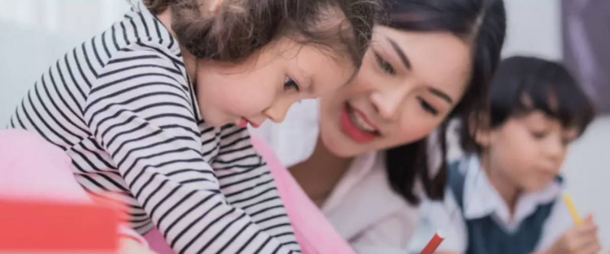 Family studies professional working with child