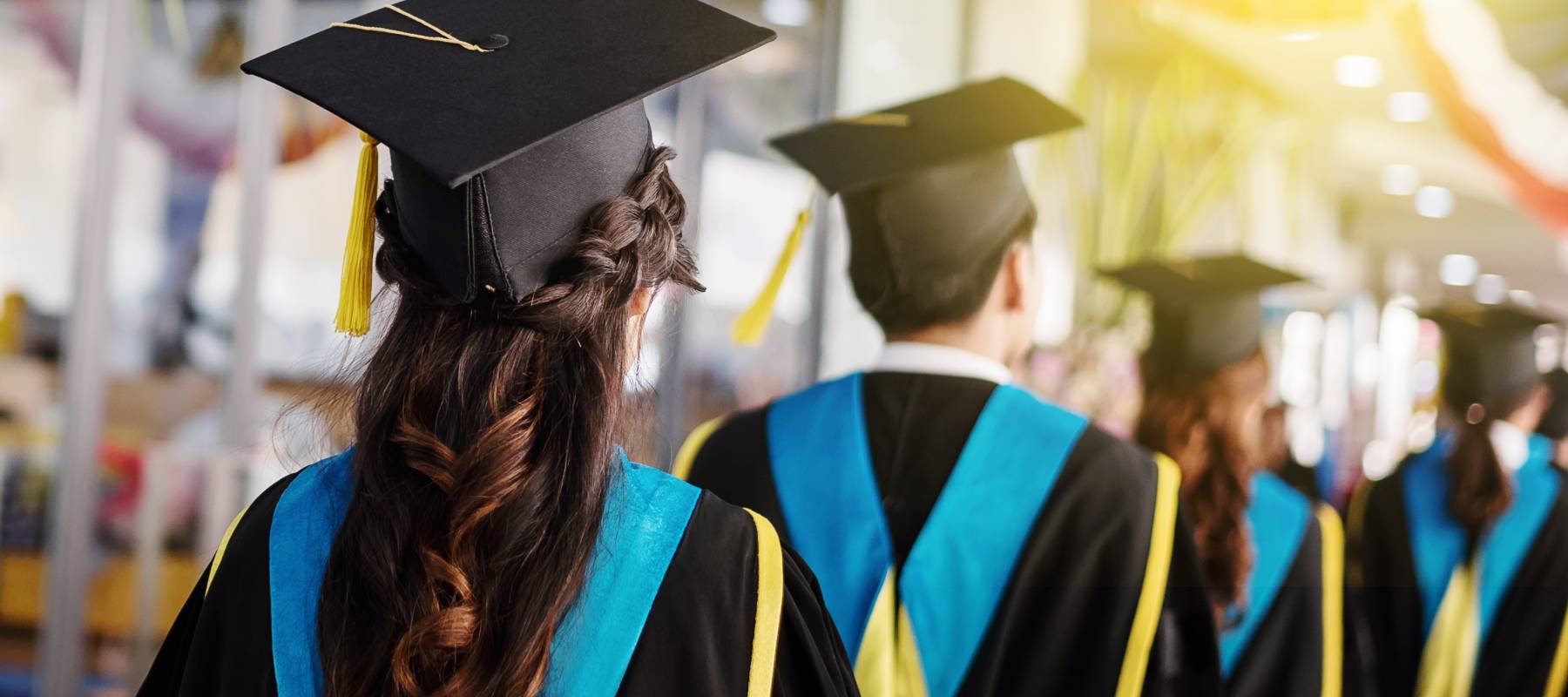 College graduates in cap and gown