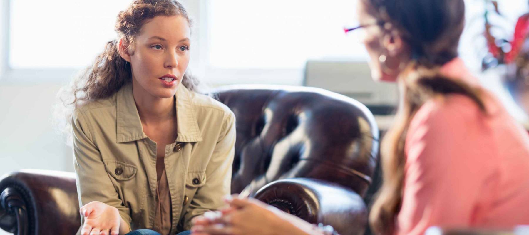 Psychologist having session with her patient in office