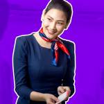 Cabin crew or Stewardess greeting passengers on airplane