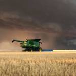 Farming with storm in distance