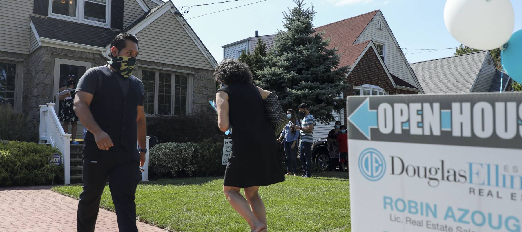 People wait to visit a house for sale in Floral Park, Nassau County, New York, the United States, on Sept. 6, 2020.