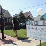 People wait to visit a house for sale in Floral Park, Nassau County, New York, the United States, on Sept. 6, 2020.