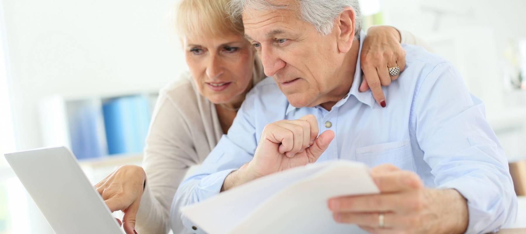 Senior couple doing the income tax declaration online