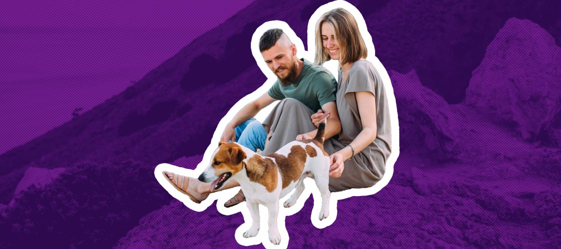 A young couple taking a break from hiking with their dog along the rocky shoreline