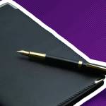 golden pen,notebook,calculator and glasses on black desk