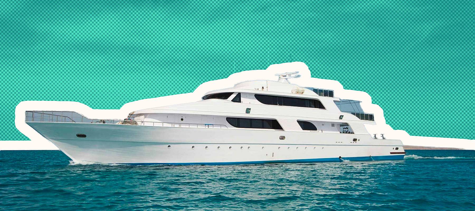 A luxury private motor yacht under way on tropical sea with bow wave