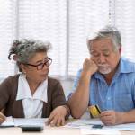 Elderly Asian couples suffering from debt problems, Living after retirement.