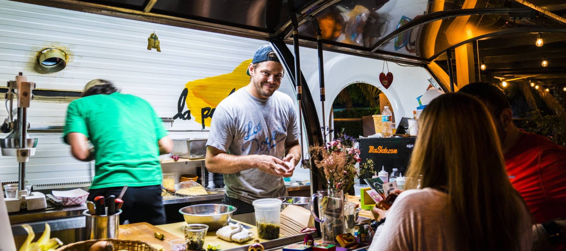 People working in a food truck