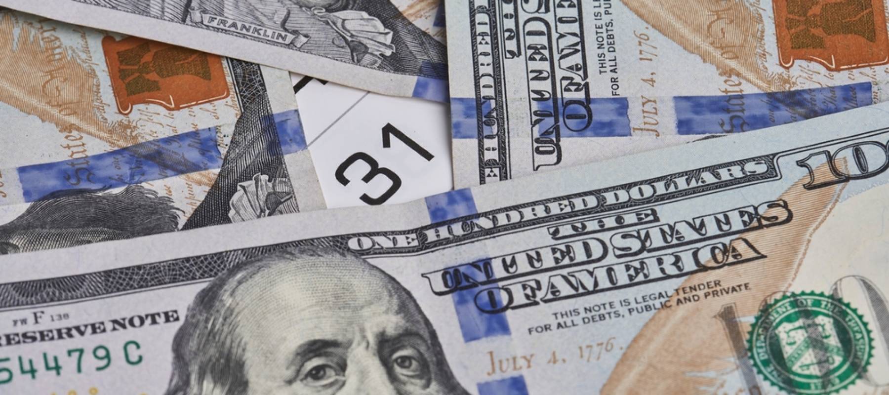 Money surrounding a calendar date