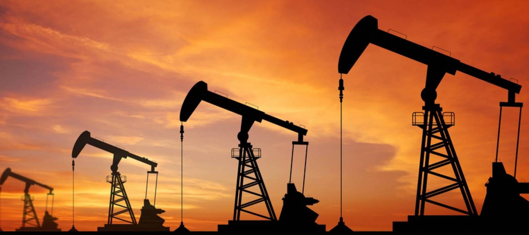 Oil pump oil rig energy industrial machine for petroleum in the sunset