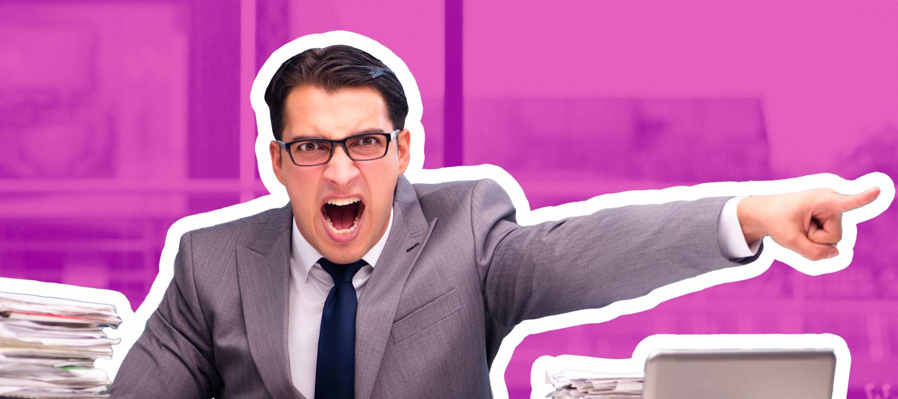 Angry man in suit yelling and pointing in an office setting