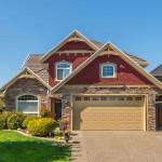 A perfect neighbourhood. Houses in suburb at Summer in the north America. Luxury houses with nice landscape.
