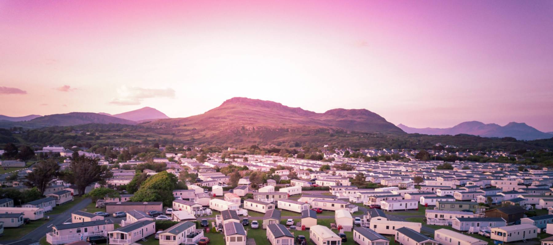 Sun set at a Caravan and camping park, static home aerial view.