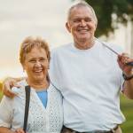 portrait of happy senior couple enjoying active lifestyle playing golf