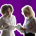 Younger employee talking to older employee
