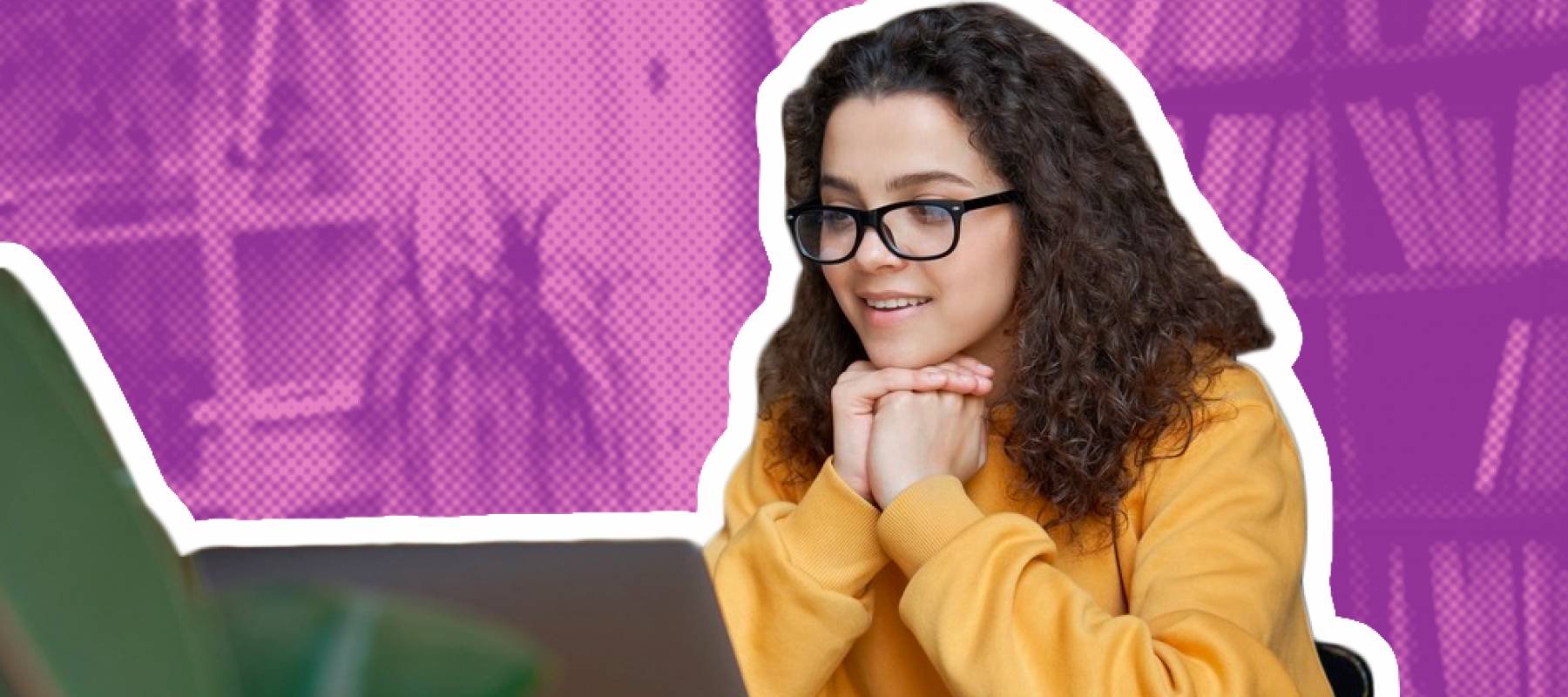 Young woman with hands clasped under her chin looking at laptop.