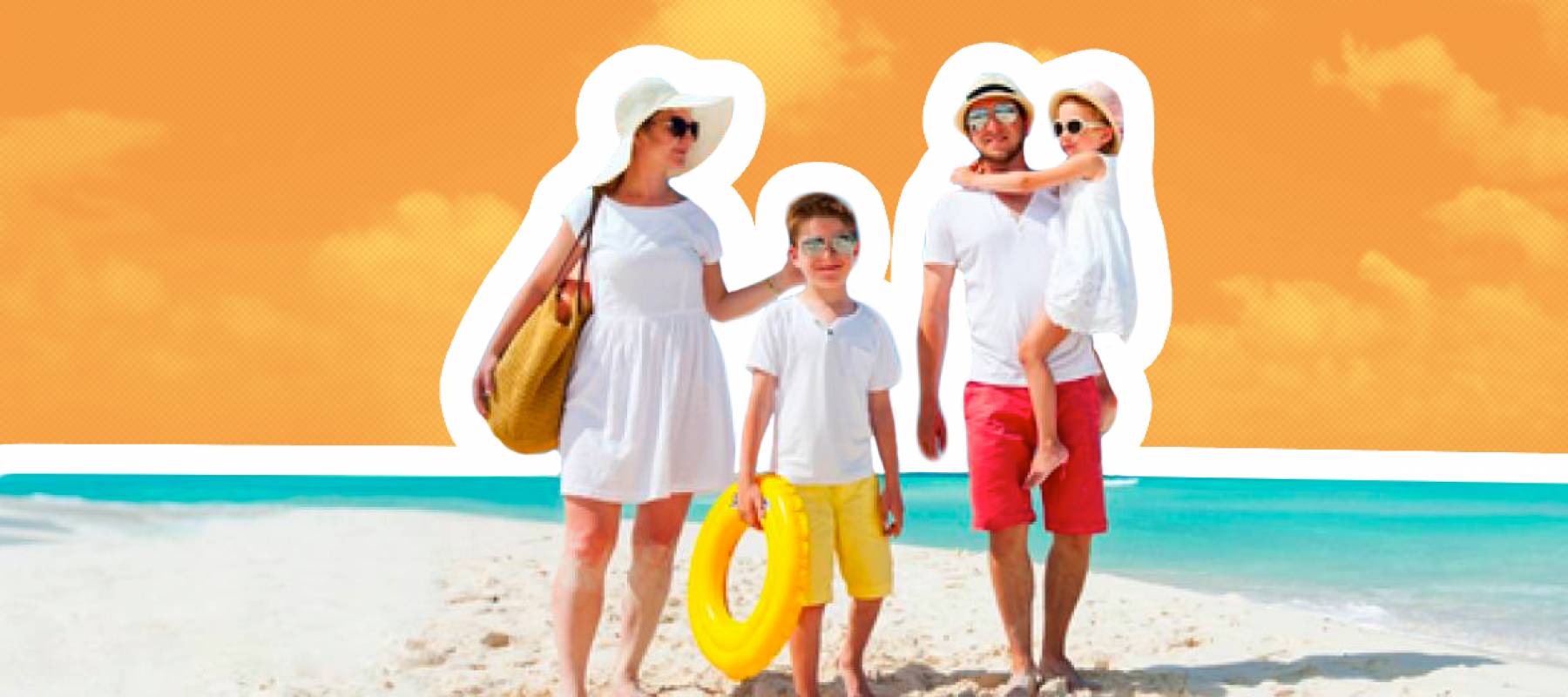 A happy family of four walks along a pristine beach.