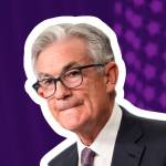 Federal Reserve Chairman Jerome Powell purses his lips while speaking at a press conference.