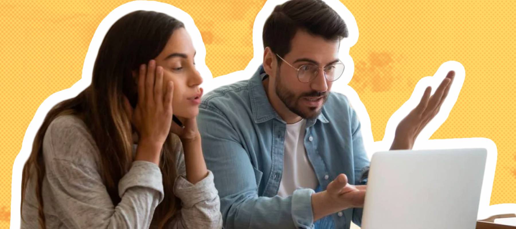 young couple frustrated, paying bills online in kitchen