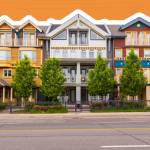 Different colored houses in The Beaches area of Toronto during the day.