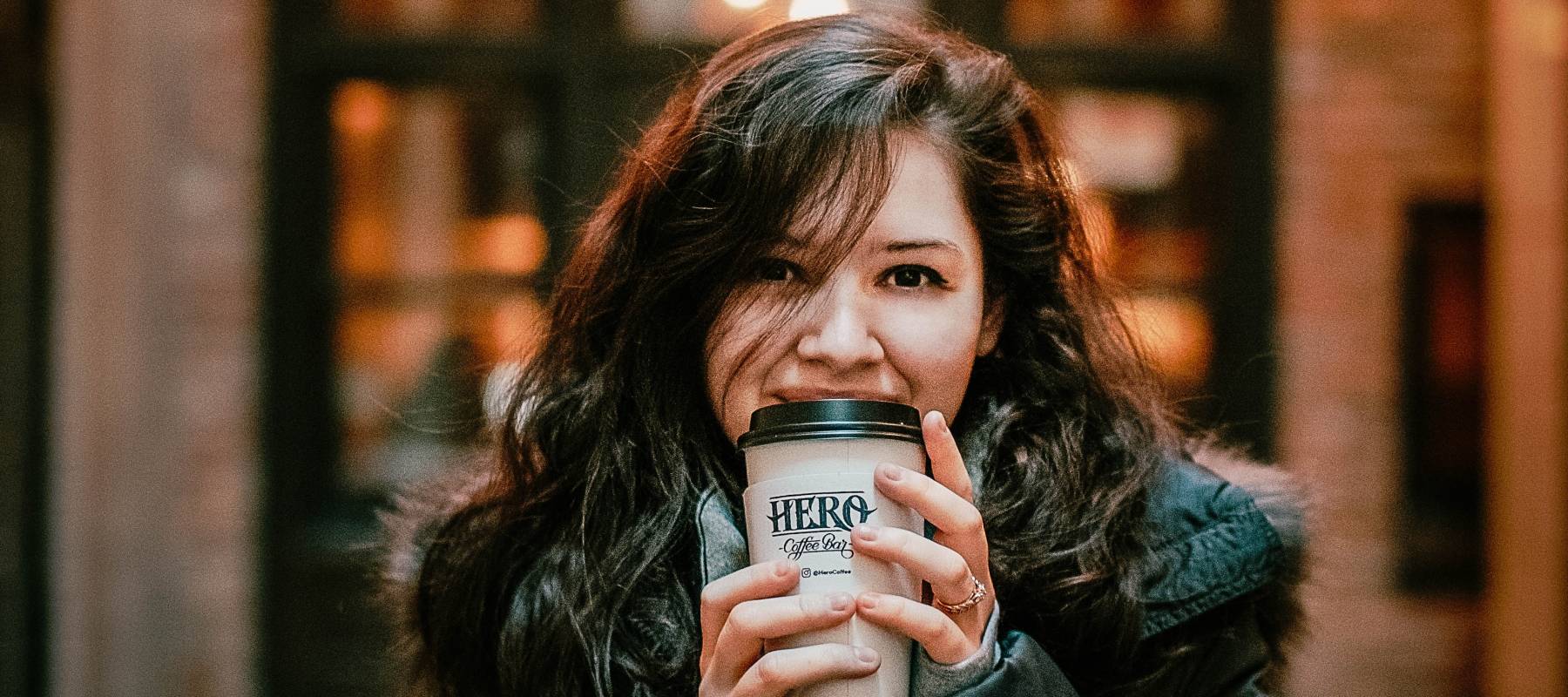 Woman holding cup of coffee