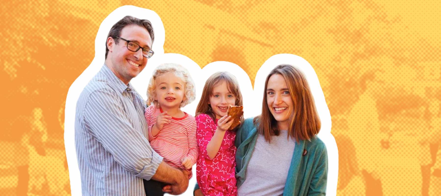 Parents holding young kids and posing smiling for the camera at a block party.