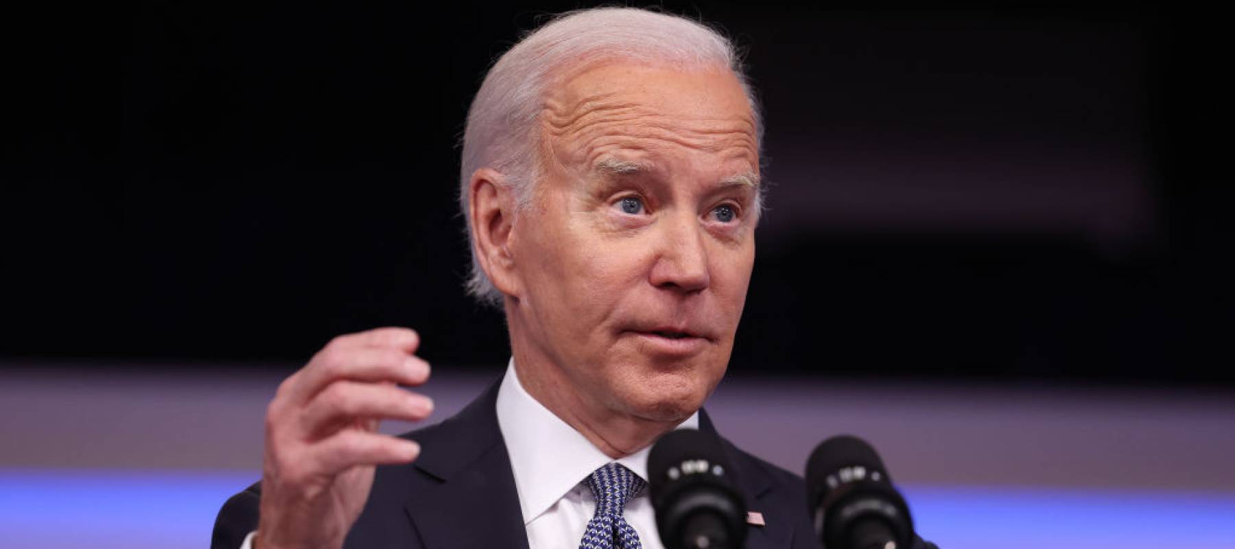 .S. President Joe Biden delivers remarks onstage in front of a podium.