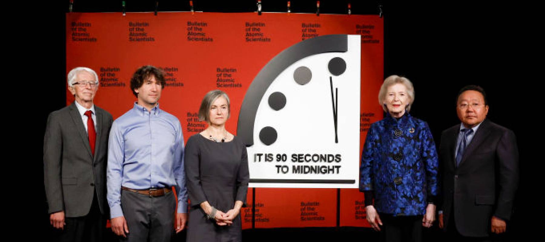 Members of the Bulletin of the Atomic Scientists Siegfried S. Hecker, Daniel Holz, Sharon Squassoni, Mary Robinson and Elbegdorj Tsakhia stand for a photo with the 2023 Doomsday Clock.