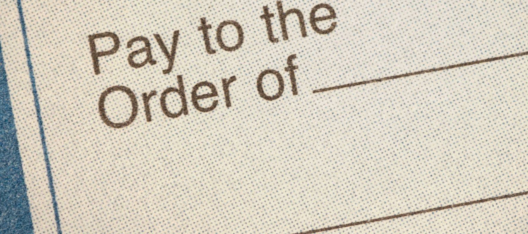 Closeup of a money order Pay to the Order Of line