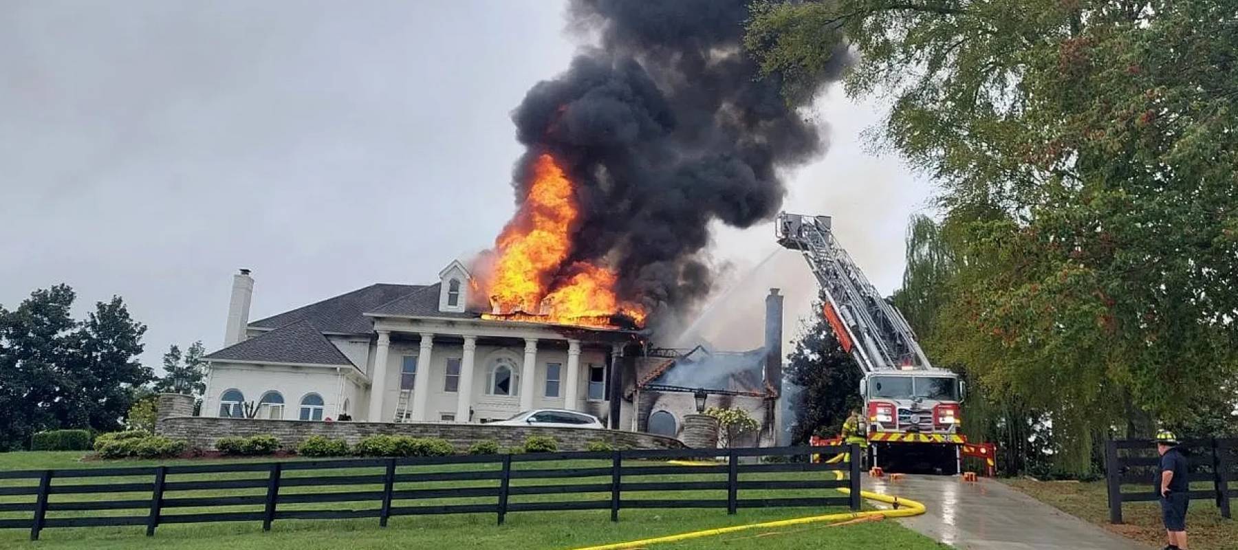 Big white mansion on fire.