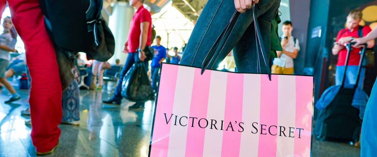 MOSCOW, RUSSIA - CIRCA AUGUST, 2018:  a woman stand with Victoria's secret branded shopping bag in Vnukovo International Airport