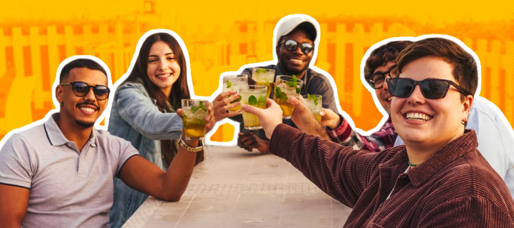 A group of friends having fun drinking fresh cocktails at outdoors pub cafe smiling and looking at the camera toasting together.