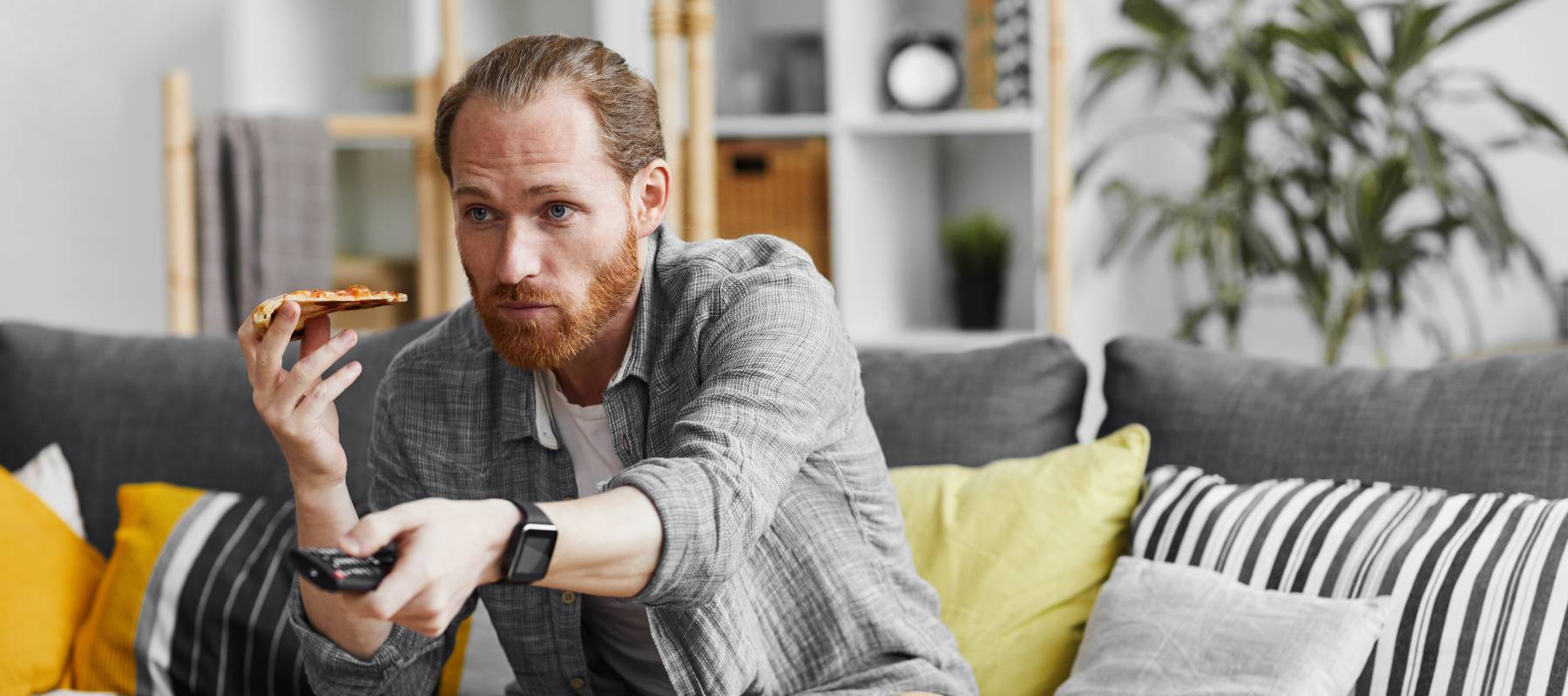 Single male eating pizza